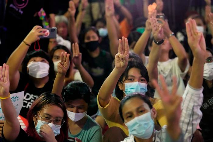 Supporters of Pita Limjaroenrat’s Move Forward party raise a three-finger salute, a symbol of resistance, during a protest in Bangkok on Wednesday