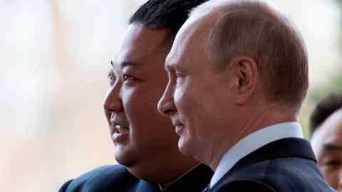 Vladimir Putin and Kim Jong Un post for a photo in 2019
